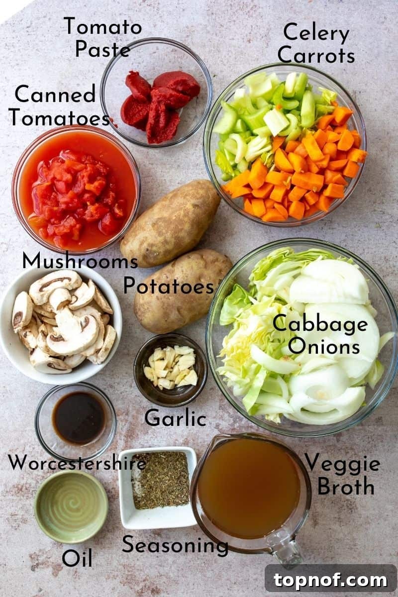 Garden Goodness Stew 3 A colorful array of fresh ingredients for veggie stew, prepped in small bowls on a wooden board.