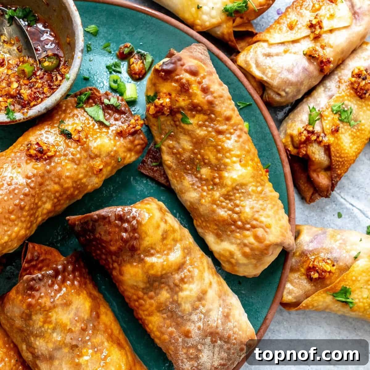 Crispy Vegetarian Egg Rolls served on a vibrant green plate, ready to be enjoyed as a healthy appetizer.