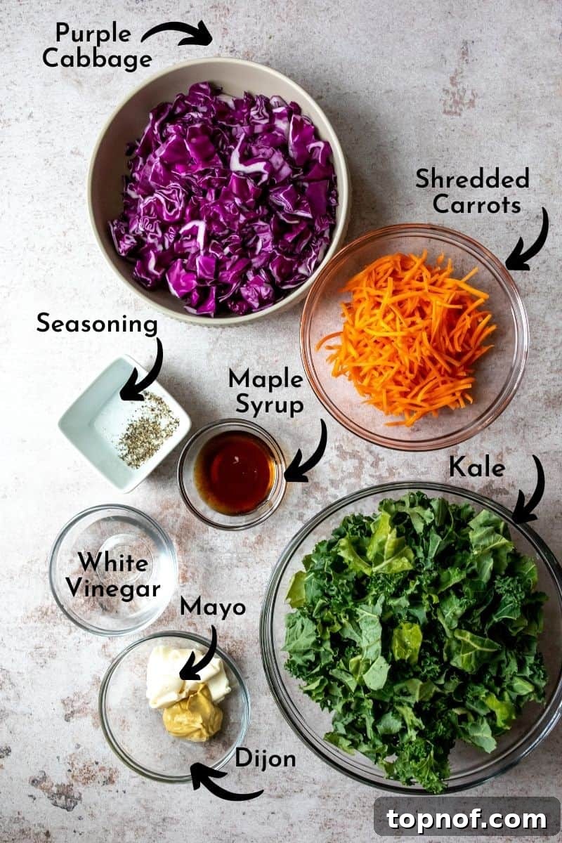 Vibrant Kale Slaw Perfection 3 Individual bowls holding ingredients for kale slaw, including chopped kale, shredded carrots, and red cabbage.