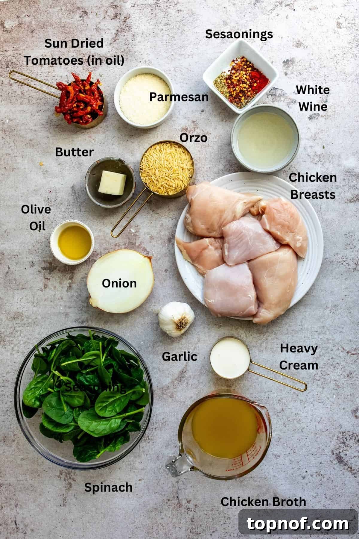 Chicken Orzo skillet ingredients on a counter in measuring cups and bowls. Fresh and vibrant components ready for cooking.