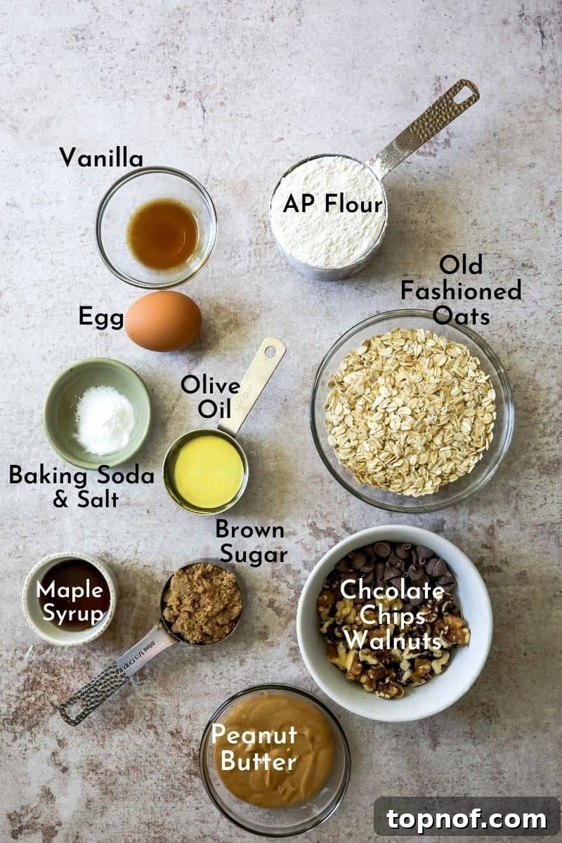 Fudgy Peanut Butter Chocolate Oat Bars 3 A collection of fresh ingredients laid out, ready to make the chocolate peanut butter oatmeal bars, including oats, flour, sugars, and chocolate chips.