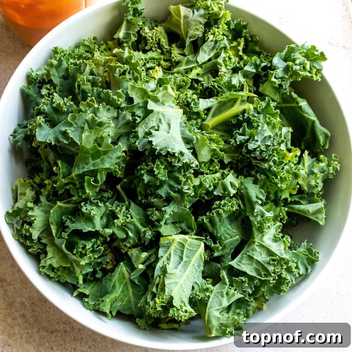 Vibrant Kale with Smoky Red Pepper Dressing 4 Chopped kale in a bowl.