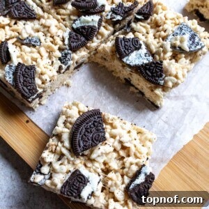 Cookies and Cream Rice Krispie Treats on a cutting board.