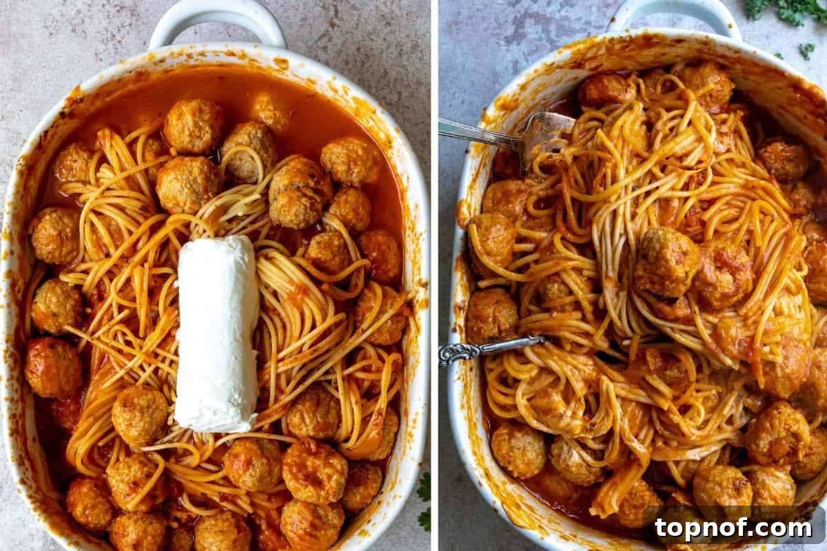Cheesy Baked Spaghetti and Meatball Casserole 5 Baked spaghetti and meatballs cooking in a white dish, with goat cheese added, bubbling hot.