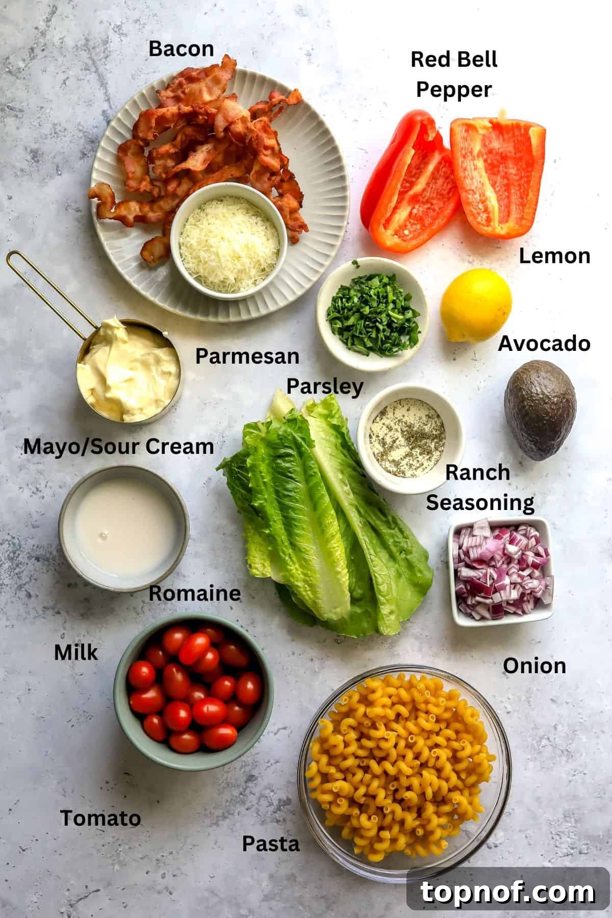 Savory BLT Pasta Toss 3 BLT pasta salad ingredients laid out on a kitchen counter before preparation.