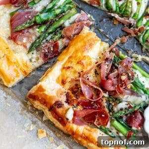 Asparagus puff pastry with prosciutto drizzled in warm garlic basil oil