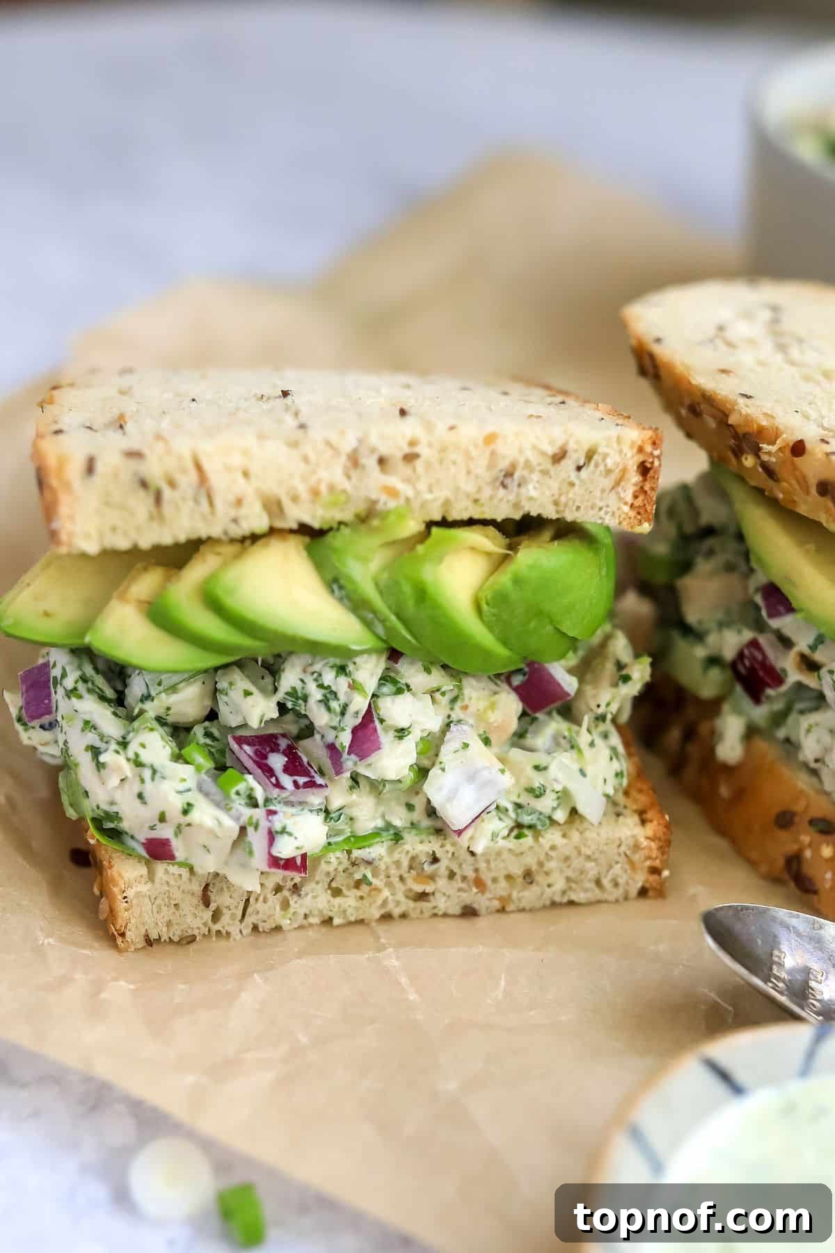 A beautifully presented Green Goddess Chicken Salad, showcasing its vibrant green hue and fresh ingredients, ready to be enjoyed.