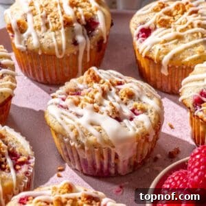 Fluffy lemon raspberry muffins with powdered sugar glaze