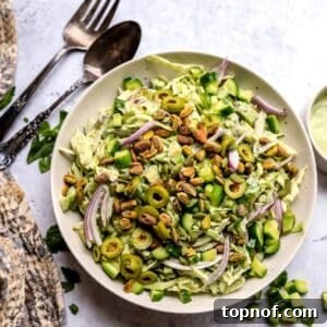 Emerald Goddess Salad 5 Green Goddess Salad recipe in a larger serving bowl with dressing to the side.