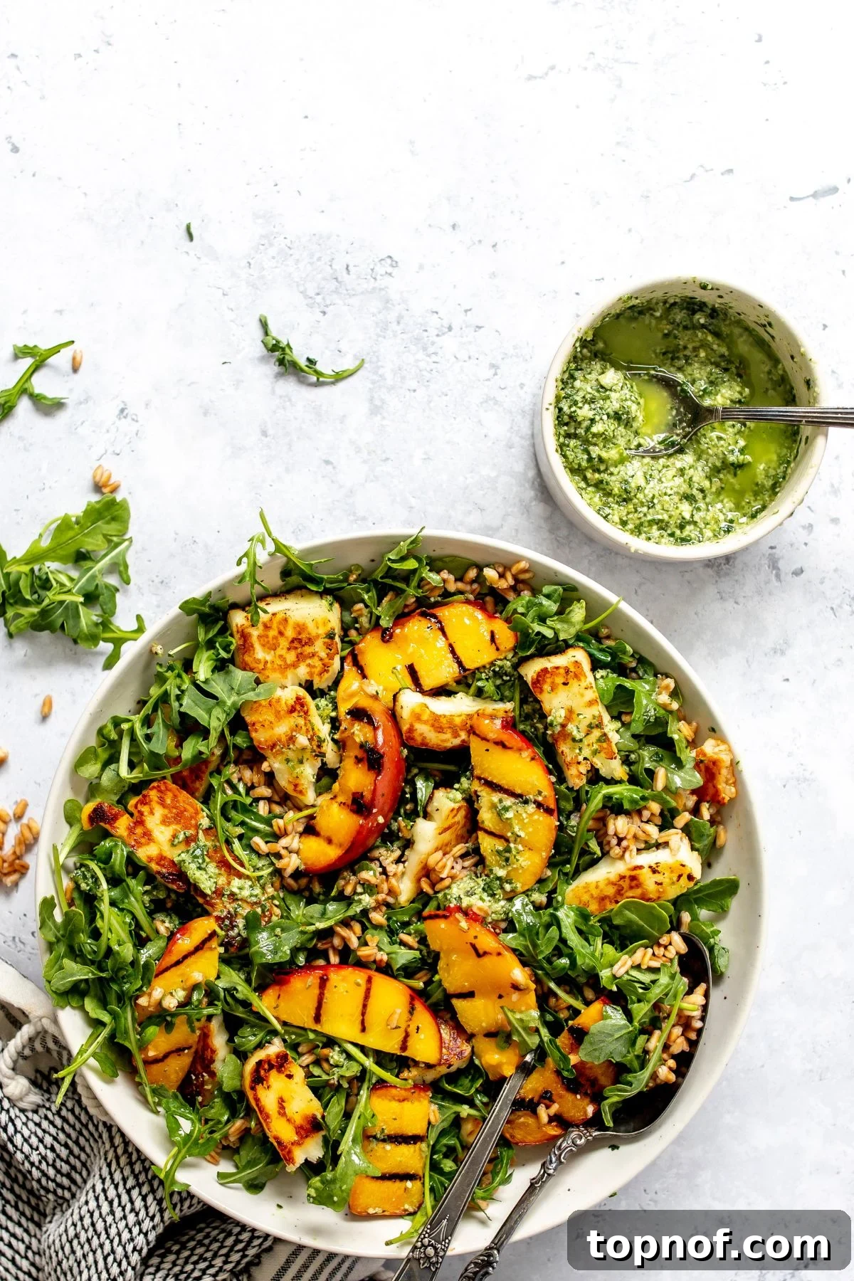 Grilled Peach and Halloumi Salad with Mint and Almonds 2 Peach and Halloumi Salad with pesto to the side.