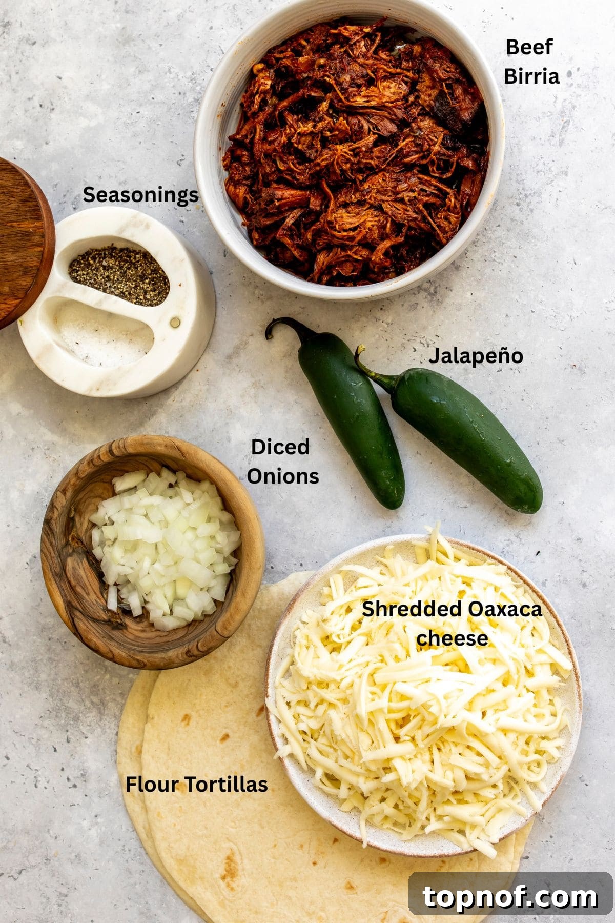 Birria Quesadillas with Dipping Consomme 3 All of the ingredients for birria quesadillas on a countertop.
