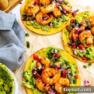 Shrimp tostadas on a piece of parchment paper for serving.